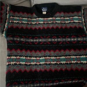 Vin. Woolrich Men's Black Crewneck Fair Isle Sweater with Red and Teal Accents.
